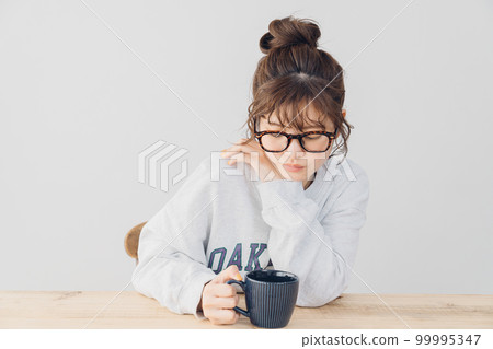 woman relaxing indoors woman relaxing indoors 99995347