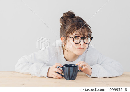 woman relaxing indoors 99995348