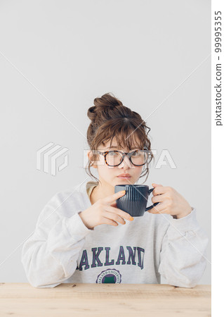 woman relaxing indoors 99995355