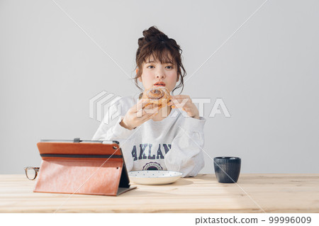 woman relaxing indoors woman relaxing indoors 99996009