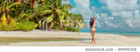 Beach travel luxury paradise private island woman traveller relaxing walking on remote beach in the Rangiroa atoll, Tuamotu islands, French Polynesia. Bikini girl on cruise excursion. Panoramic banner Beach travel luxury paradise private island woman traveller relaxing walking on remote beach in the Rangiroa atoll, Tuamotu islands, French Polynesia. Bikini girl on cruise excursion. Panoramic banner 99996566