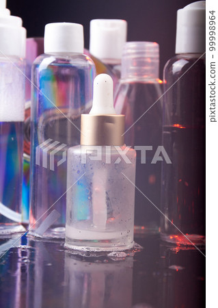 Vertical shot of various cosmetic bottles. Beauty and spa. 99998964