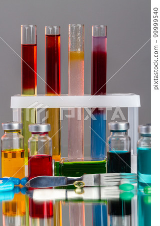 Test tubes and bottles with various colored liquids. Scientific lab medicine reserarch. 99999540