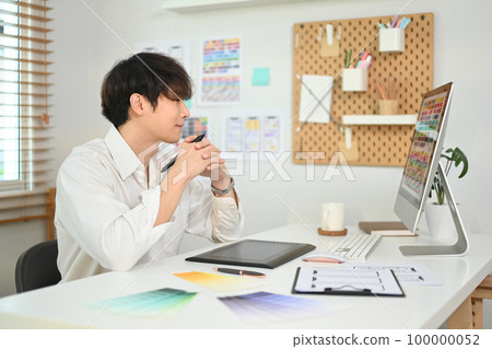 Professional web developer creating website wireframe sketches at modern creative office 100000052