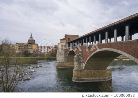 Bridge over Ticino river in Pavia at overcast day 100000058