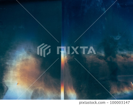 Grunge overlay. Weathered film. Distressed filter. Blue orange light flare dirt stains dust scratches noise on dark blue worn faded abstract illustration background. Grunge overlay. Weathered film. Distressed filter. Blue orange light flare dirt stains dust scratches noise on dark blue worn faded abstract illustration background. 100003147