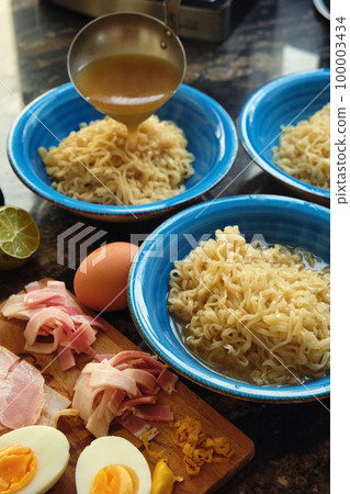 ramen soup in plates ingredients on the table 100003434