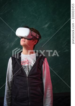 a boy playing with VR glasses a boy playing with VR glasses 100003455