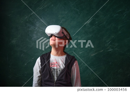 a boy playing with VR glasses a boy playing with VR glasses 100003456