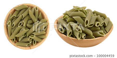 Green pea penne pasta in wooden bowl isolated on white background . Organic food speciality. Gluten free. Top view. Flat lay Green pea penne pasta in wooden bowl isolated on white background . Organic food speciality. Gluten free. Top view. Flat lay 100004459