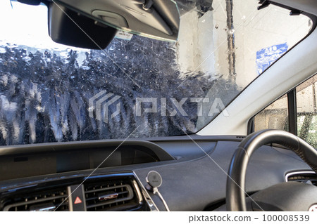 Inside a car being washed with an automatic car wash machine Inside a car being washed with an automatic car wash machine 100008539