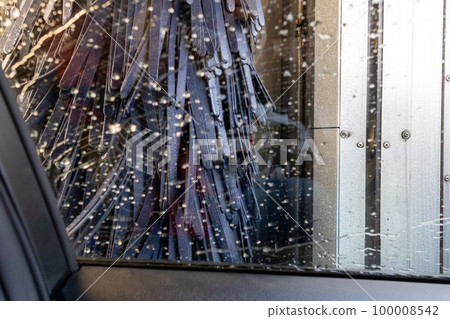 Inside a car being washed with an automatic car wash machine Inside a car being washed with an automatic car wash machine 100008542