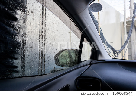 Inside a car being washed with an automatic car wash machine 100008544