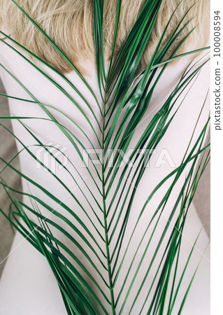 Back health. Flowers lie on the spine, symbolizing cartilage and vertebrae. Correct posture or stoop. Spine and back health concept 100008594