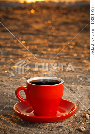 Red cup with coffee Red cup with coffee 100010553