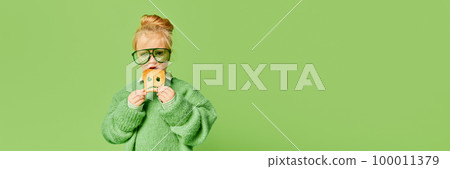 Happy smiling cute kid, little girl in fashionable look clothes and sunglasses posing over light green background. Spring fashion collection, happiness, ad concept Happy smiling cute kid, little girl in fashionable look clothes and sunglasses posing over light green background. Spring fashion collection, happiness, ad concept 100011379