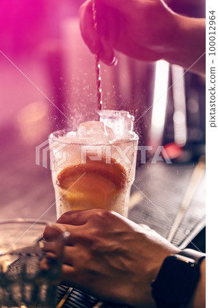 Cold cocktail with ice and orange Cold cocktail with ice and orange 100012964