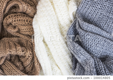 Warm knitted sweaters. autumn concept. Copy space. Women clothing. Warm knitted sweaters. autumn concept. Copy space. Women clothing. 100014805
