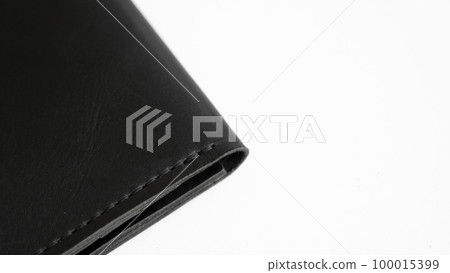 Details of open handmade brown man's genuine leather wallet with zipper on a button for banknotes and credit cards isolated on white background. Details of open handmade brown man's genuine leather wallet with zipper on a button for banknotes and credit cards isolated on white background. 100015399