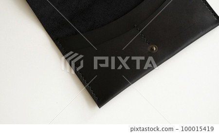 Close up of open brown elegance men's wallet on a white background. Mens leather accessories. 100015419