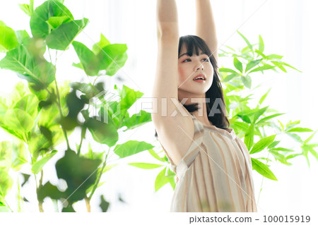 Woman surrounded by greenery Botanical image of beauty 100015919