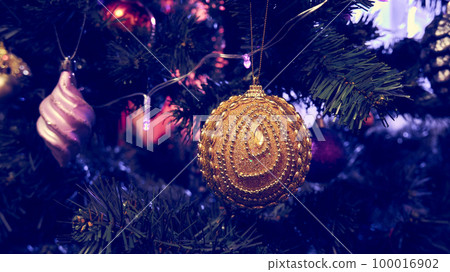 Close-up artificial Christmas tree with decorations. New Year concept Close-up artificial Christmas tree with decorations. New Year concept 100016902