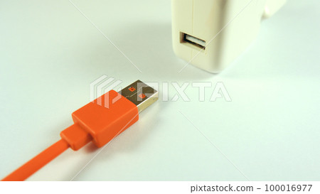 usb charger and cable on a white background close up 100016977