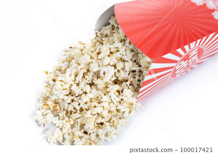Popcorn in red and white striped cardboard bucket isolated on white background 100017421
