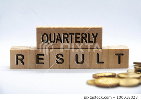 Quarterly result text engraved on wooden blocks with golden coins background. Business result concept. Quarterly result text engraved on wooden blocks with golden coins background. Business result concept. 100018028