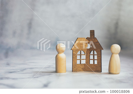 Divorce, division of property, poverty and no money concept. Wooden broken house on light background. Mortgage, rent, realtor concept copy space space for text 100018806