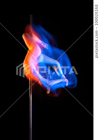 Artistic lifestyle. Young girl in bodysuit performing pole dance isolated over black studio background with mixed neon lights. Concept of art, sport and modern dance 100020168