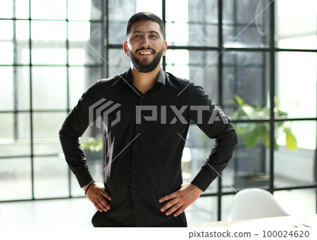 successful businessman greets in the office shaking hands successful businessman greets in the office shaking hands 100024620