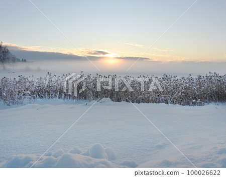 sunset over the winter lake sunset over the winter lake 100026622