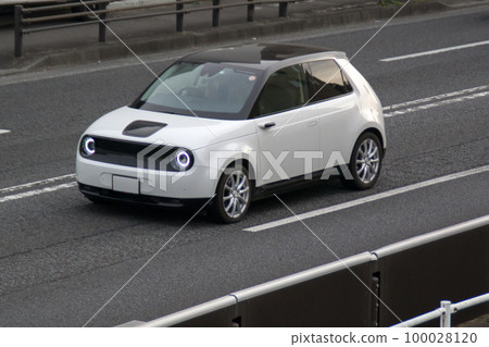 Electric car driving on the road Electric car driving on the road 100028120
