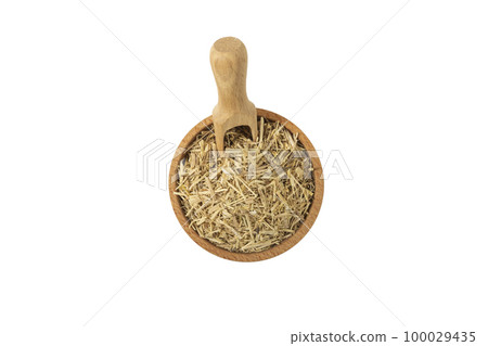 siberian ginseng in latin Eleutherococcus senticosus in wooden bowl and scoop isolated on white 100029435