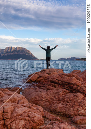 Rocky and Sandy Beach in Porto Istana, Sardinia, Italy. Tavolara Island in Background. 100029768