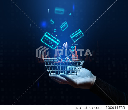 A woman's hand holds a metallic shopping cart and payment card icons, the concept of starting a sale, high income in retail business A woman's hand holds a metallic shopping cart and payment card icons, the concept of starting a sale, high income in retail business 100031733