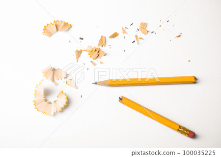 Broken pencil and shavings on white background, top view 100035225