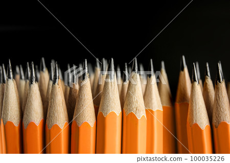 Many graphite pencils on black background, closeup Many graphite pencils on black background, closeup 100035226