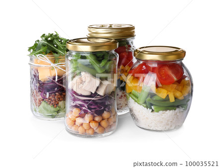 Glass jars with healthy meal isolated on white 100035521