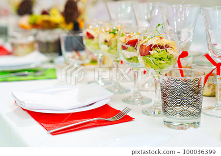 original serving of portioned salads on the table. catering. original serving of portioned salads on the table. catering. 100036399