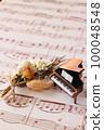 antique piano and sheet music 100048548
