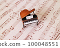 antique piano and sheet music 100048551