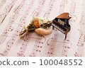antique piano and sheet music 100048552