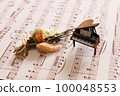 antique piano and sheet music 100048553