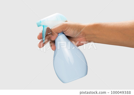 Hand holding a disinfectant spray 100049388