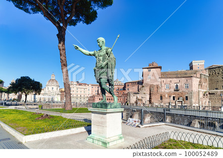 Statue of Emperor Traiano along  Fori Imperiali street in Rome 100052489