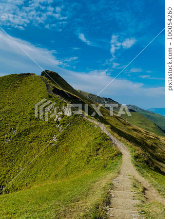 Mountain range in Swiss Alps in sunny day Mountain range in Swiss Alps in sunny day 100054260