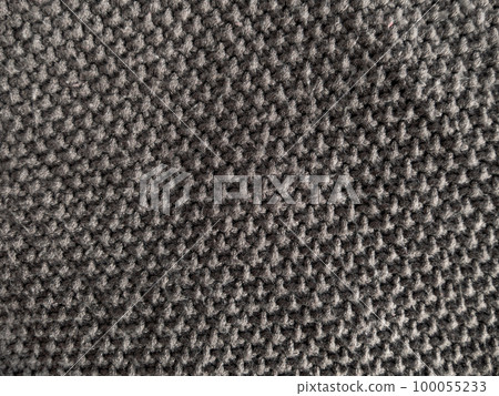 Gray knitted texture woolen fabric Textile knit pattern wallpaper background surface design. Handmade shop cozy backdrop 100055233