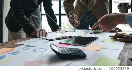 Business people meeting using laptop computer, calculator, stock market chart paper for analysis planning to improve quality next month. Conference discussion corporate concept Business people meeting using laptop computer, calculator, stock market chart paper for analysis planning to improve quality next month. Conference discussion corporate concept 100055829